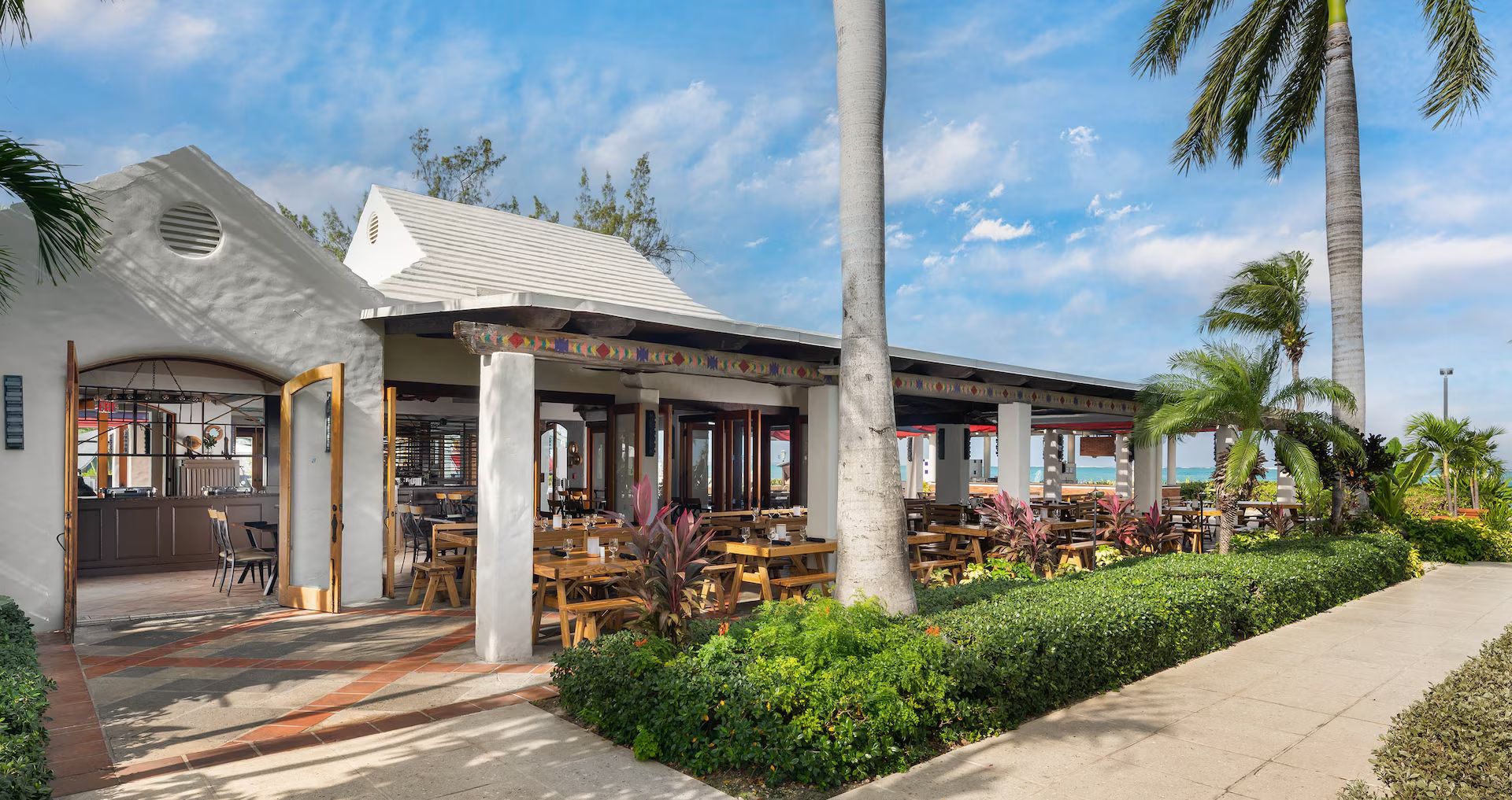 A plantation-style restaurant with a shaded porch in Turks & Caicos