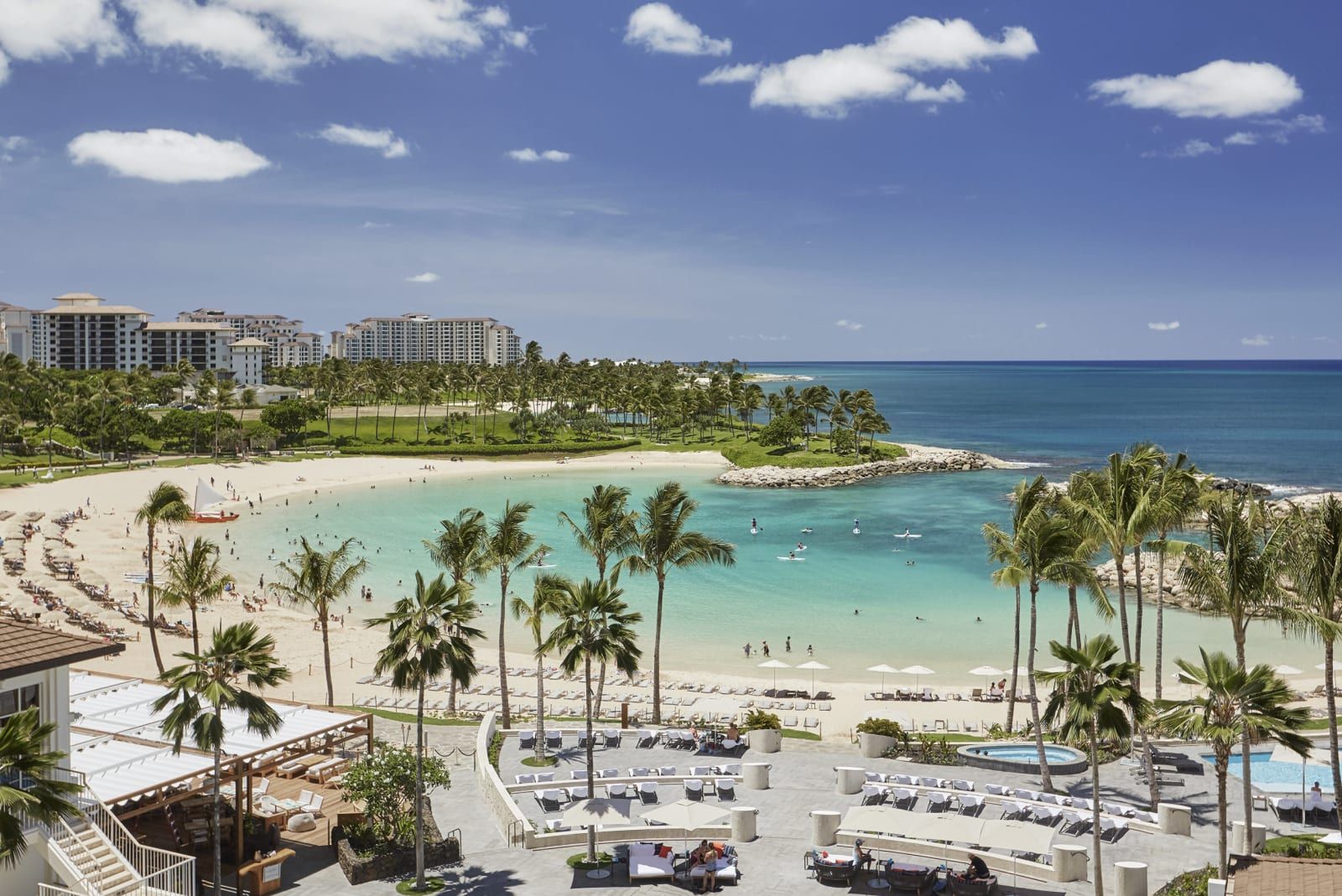 The resort's beach and calm Ko Olina lagoon, ringed by palms