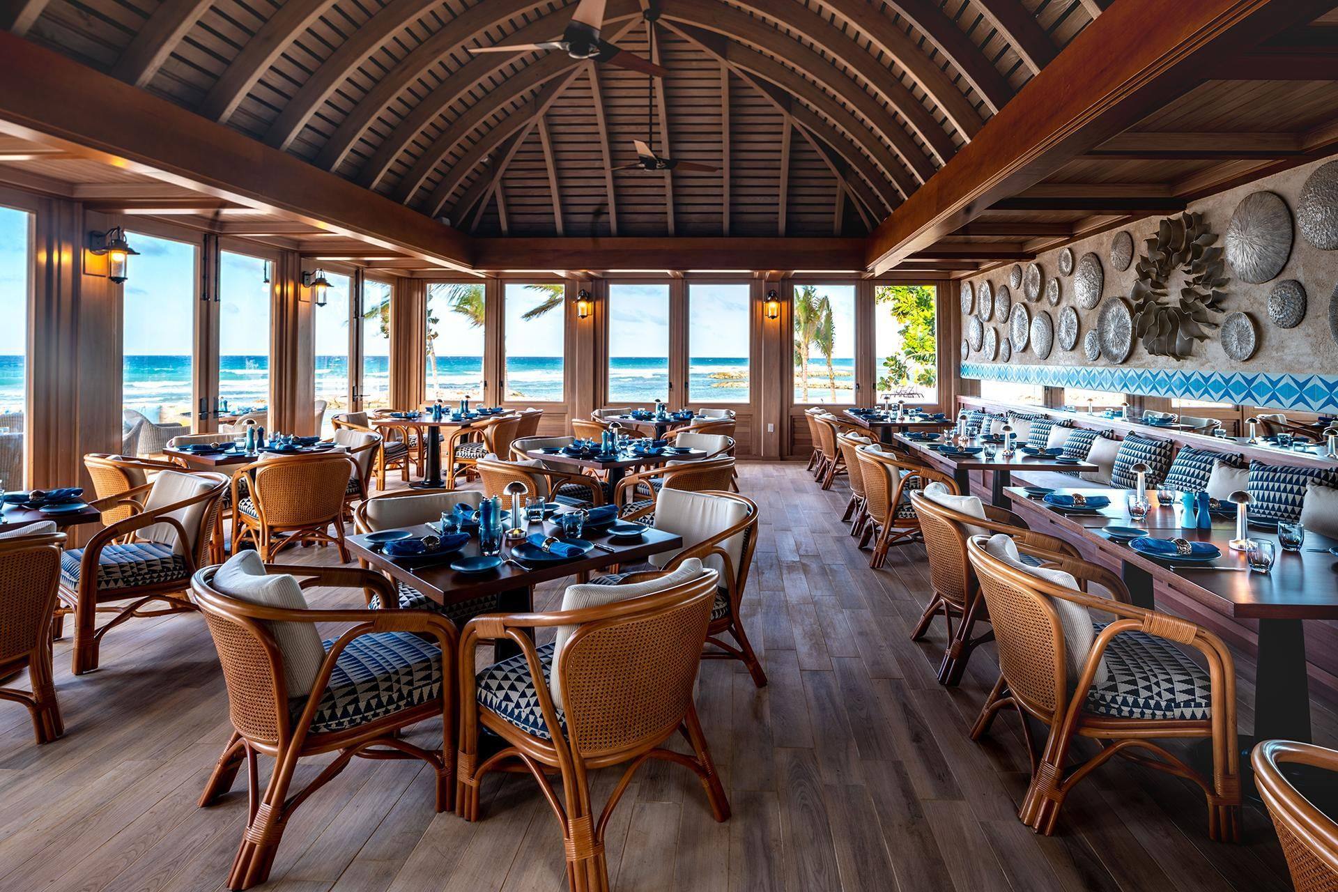 An open-air restaurant under a vaulted wooden roof