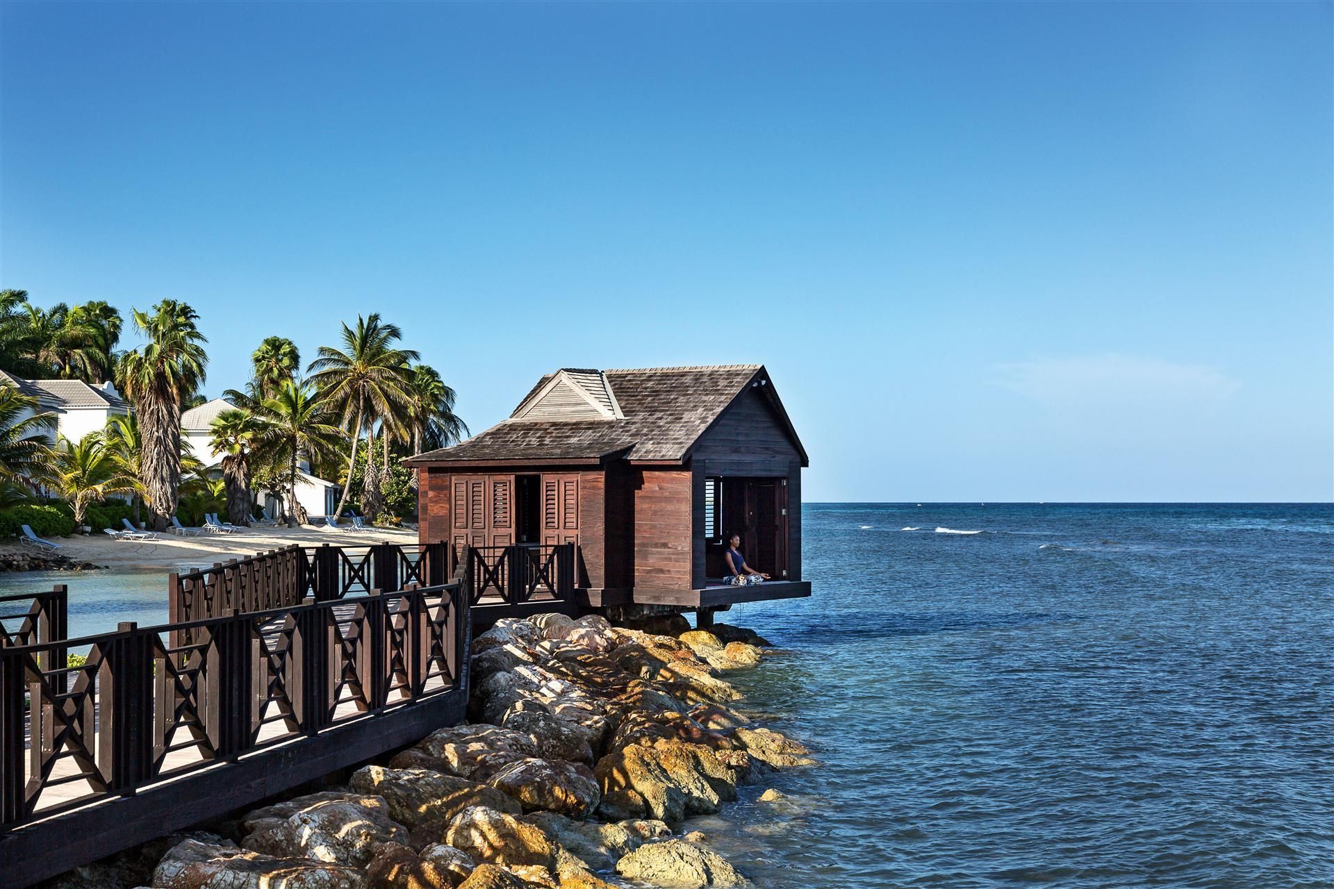 A spa cabana built out over the sea
