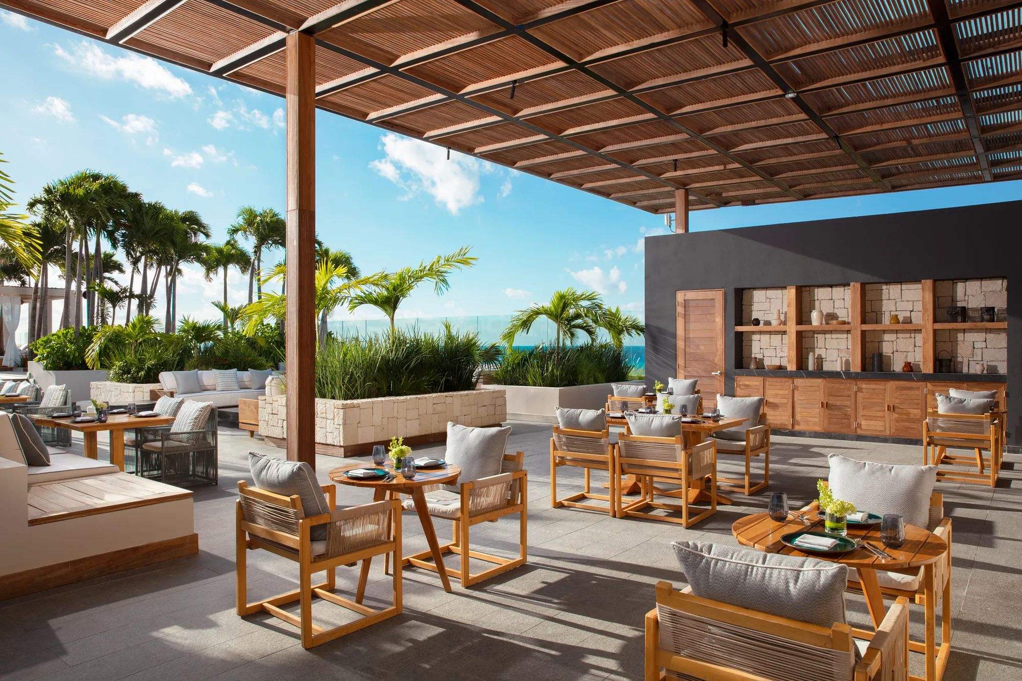 Cielo, the rooftop restaurant, with shaded tables and lounge chairs