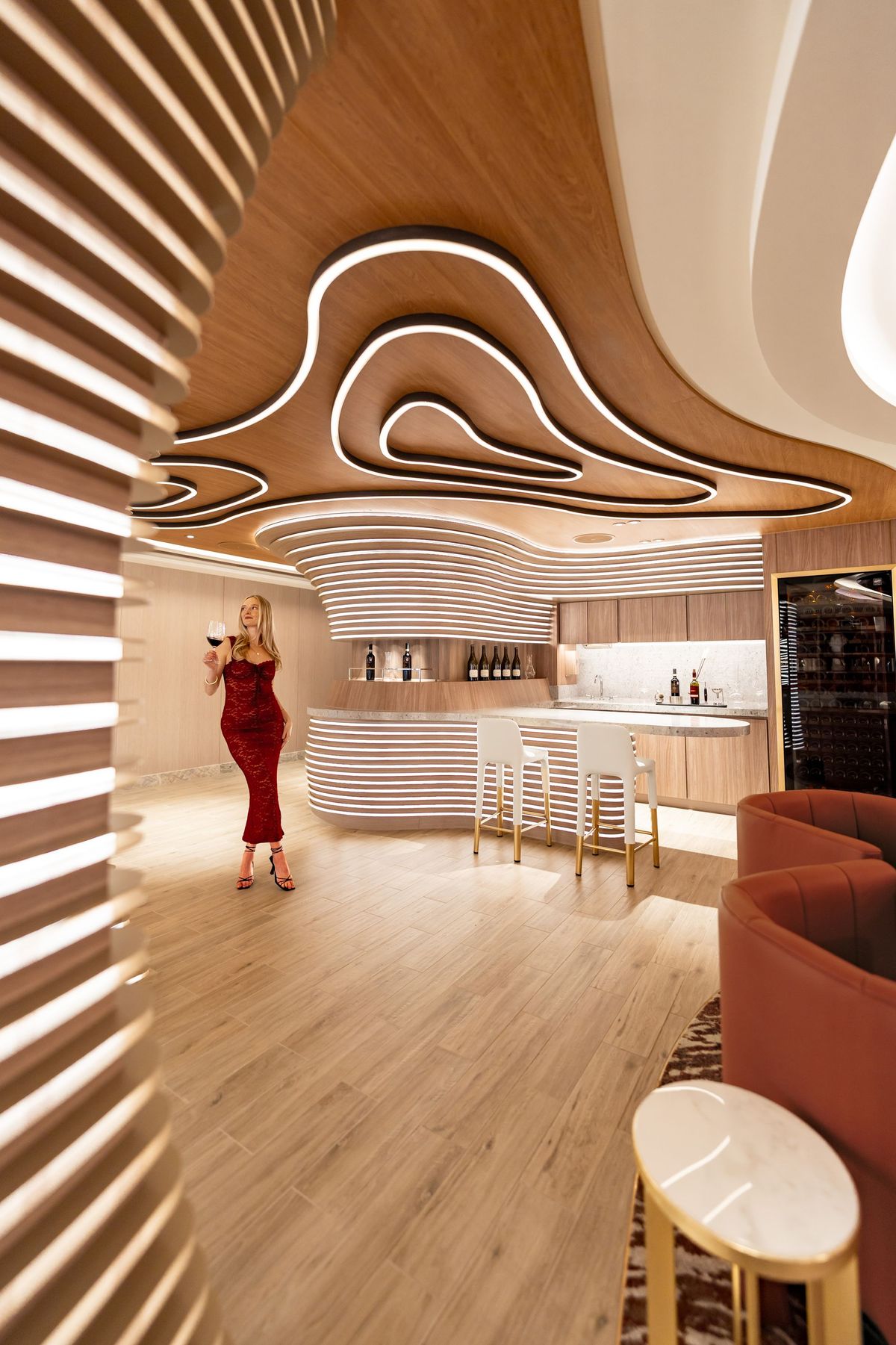 A swirl-ceilinged bar aboard Norwegian Aqua