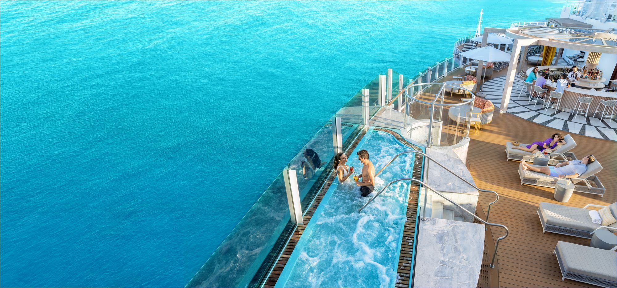 A glass-edged pool deck at the ship's stern, high above the sea