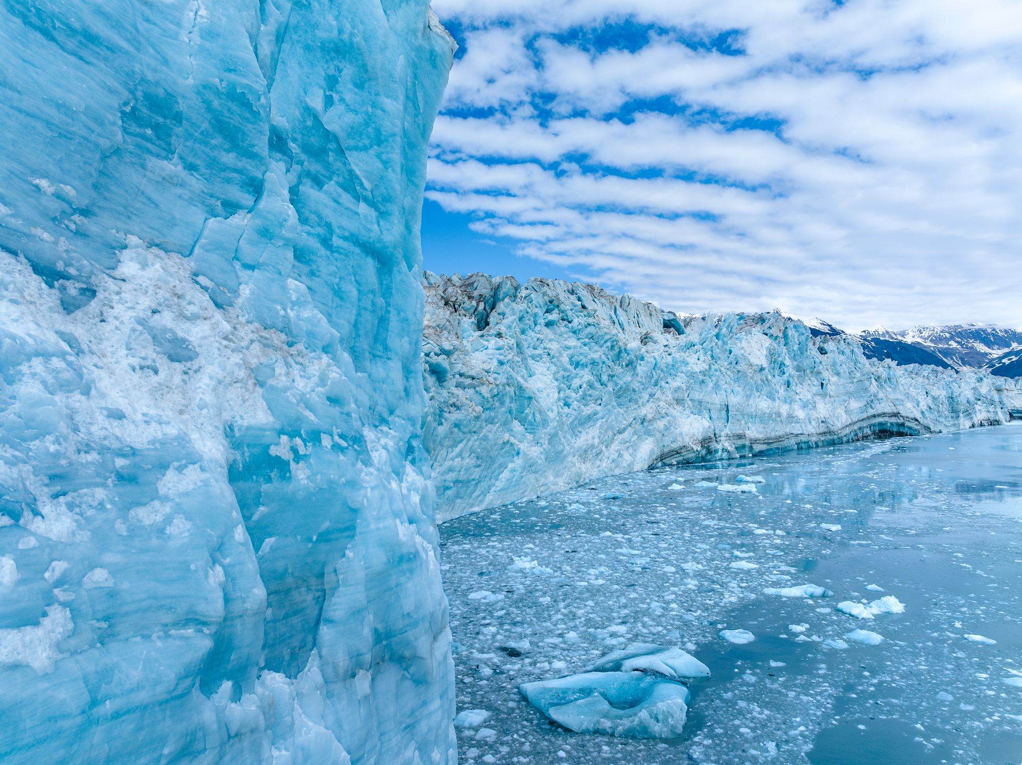 The blue ice face of Hubbard Glacier above floating ice