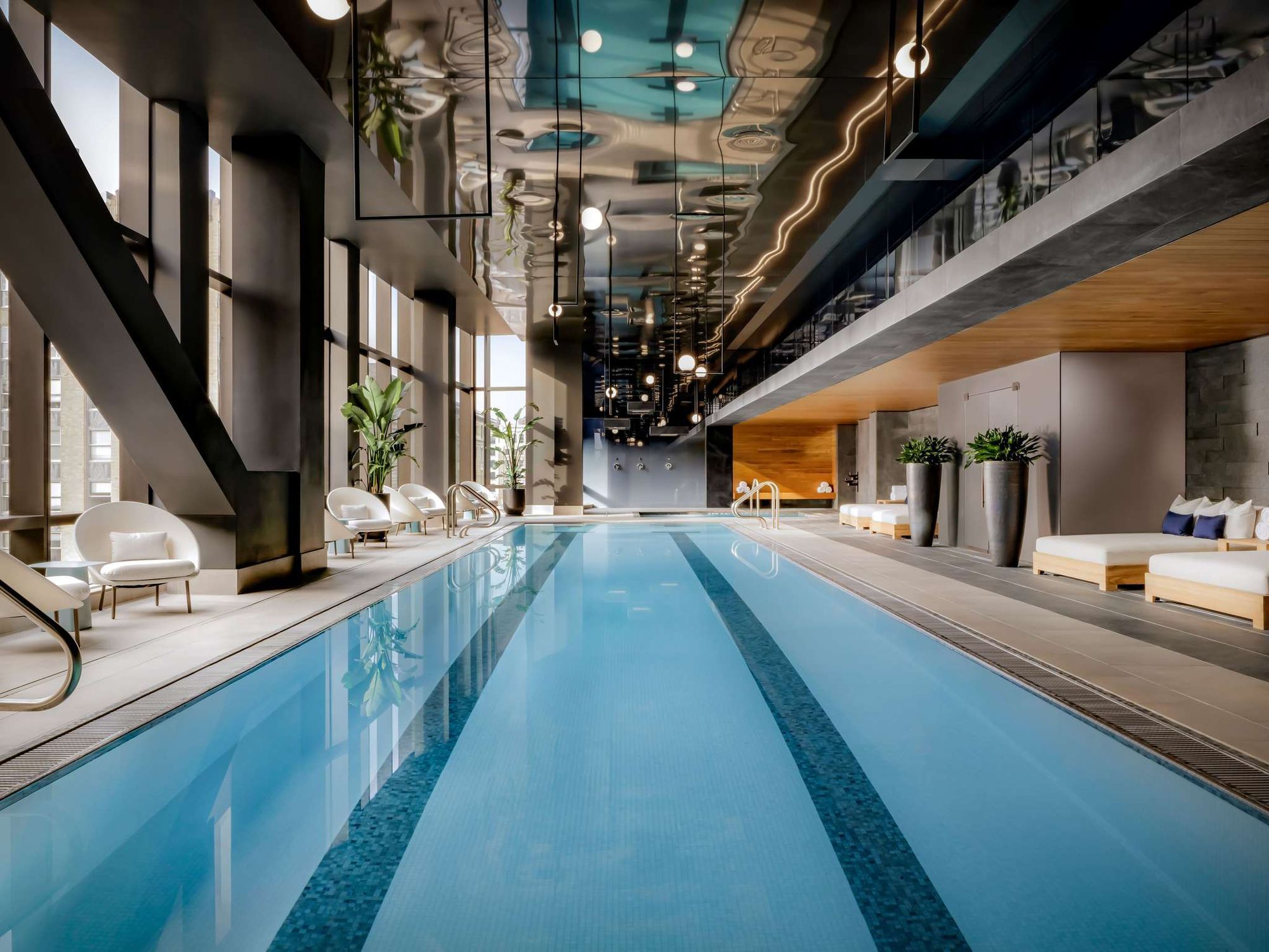 The indoor lap pool with loungers alongside
