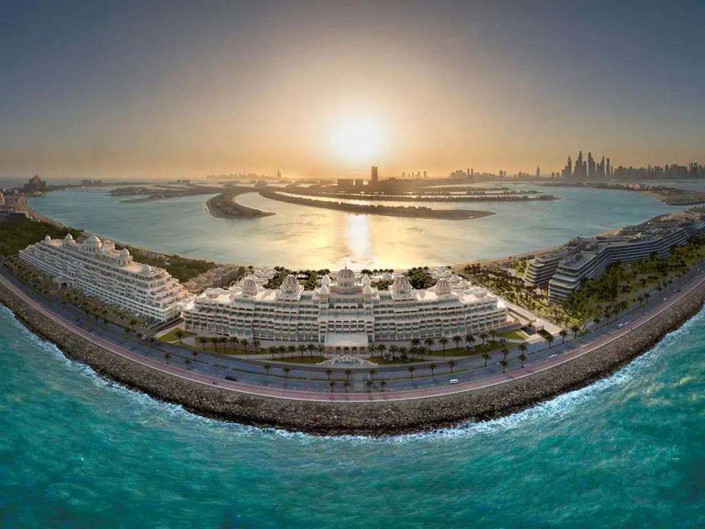 The resort stretched along the Palm's outer crescent at sunset, with Dubai's skyline across the water
