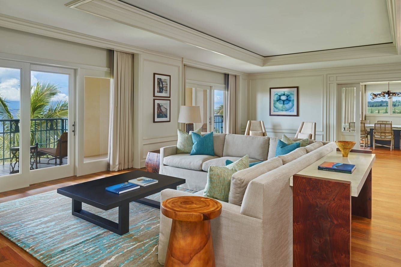 A residential suite living room in soft blues