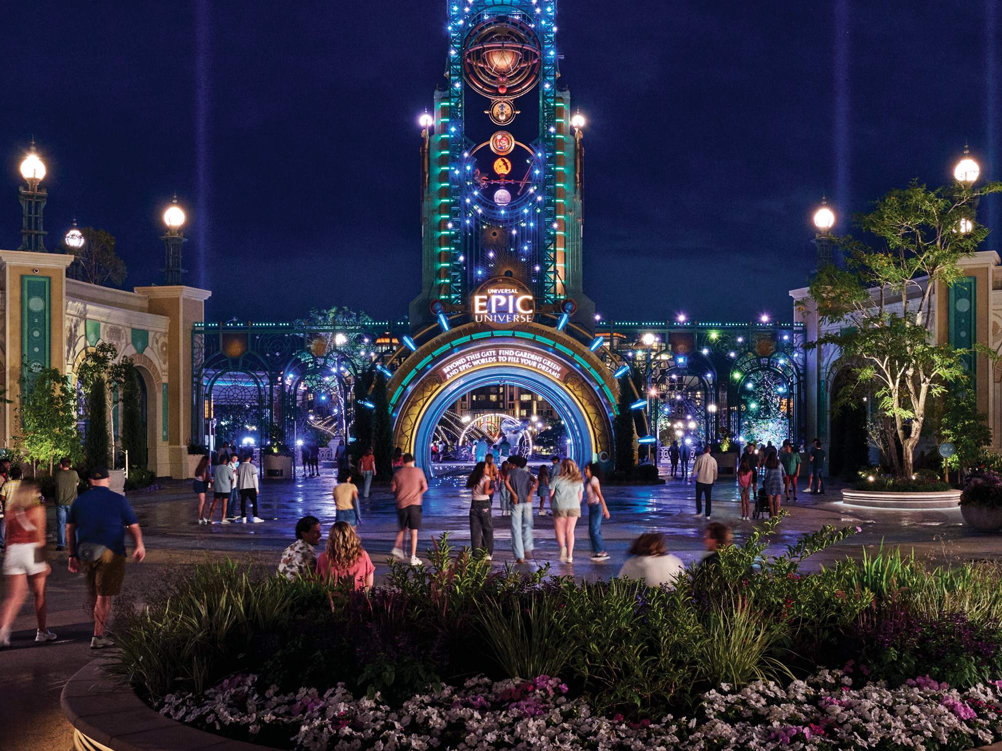 The Chronos tower lit up at night in Celestial Park, Universal Epic Universe