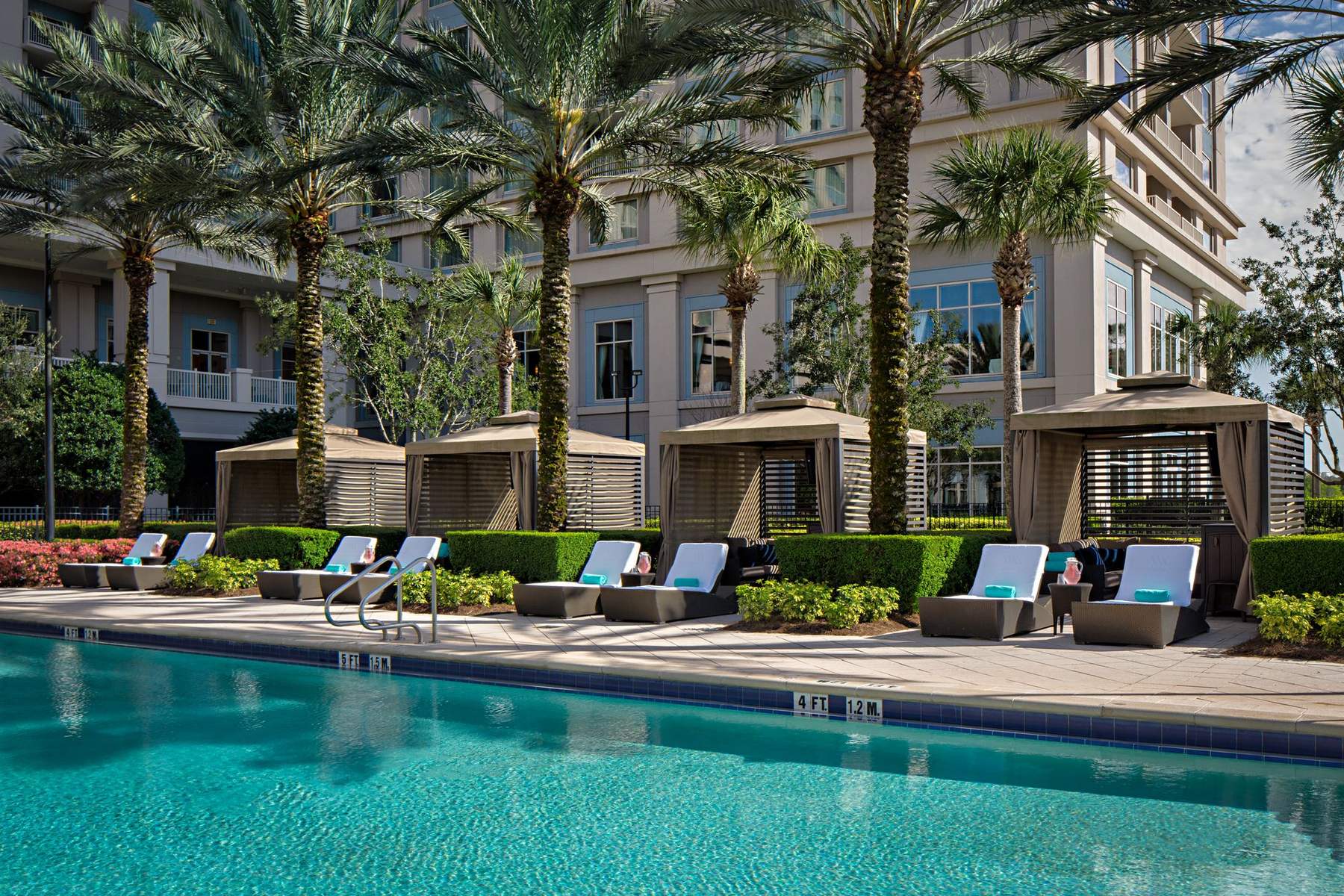 Private cabanas beside a quiet pool